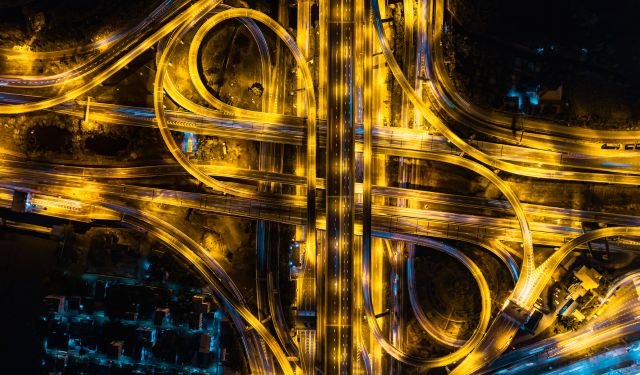 highway junction hub multiple roads areaial view at night