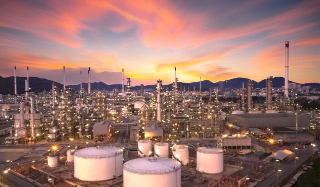 oil and gas plant at sunrise