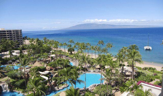 a hotel at the holiday resort by the ocean with outdoor pools
