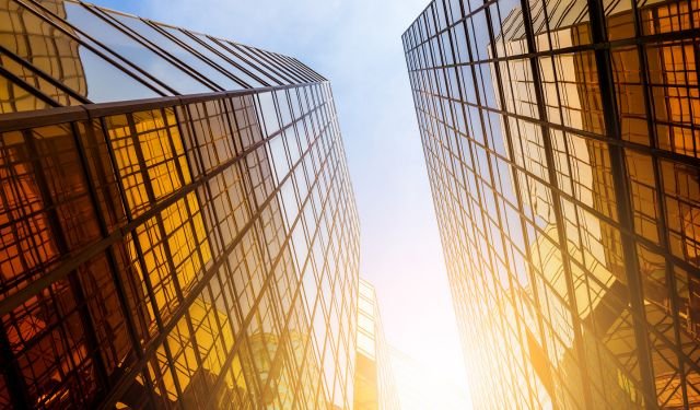 two yellow glass comercial tower blocks